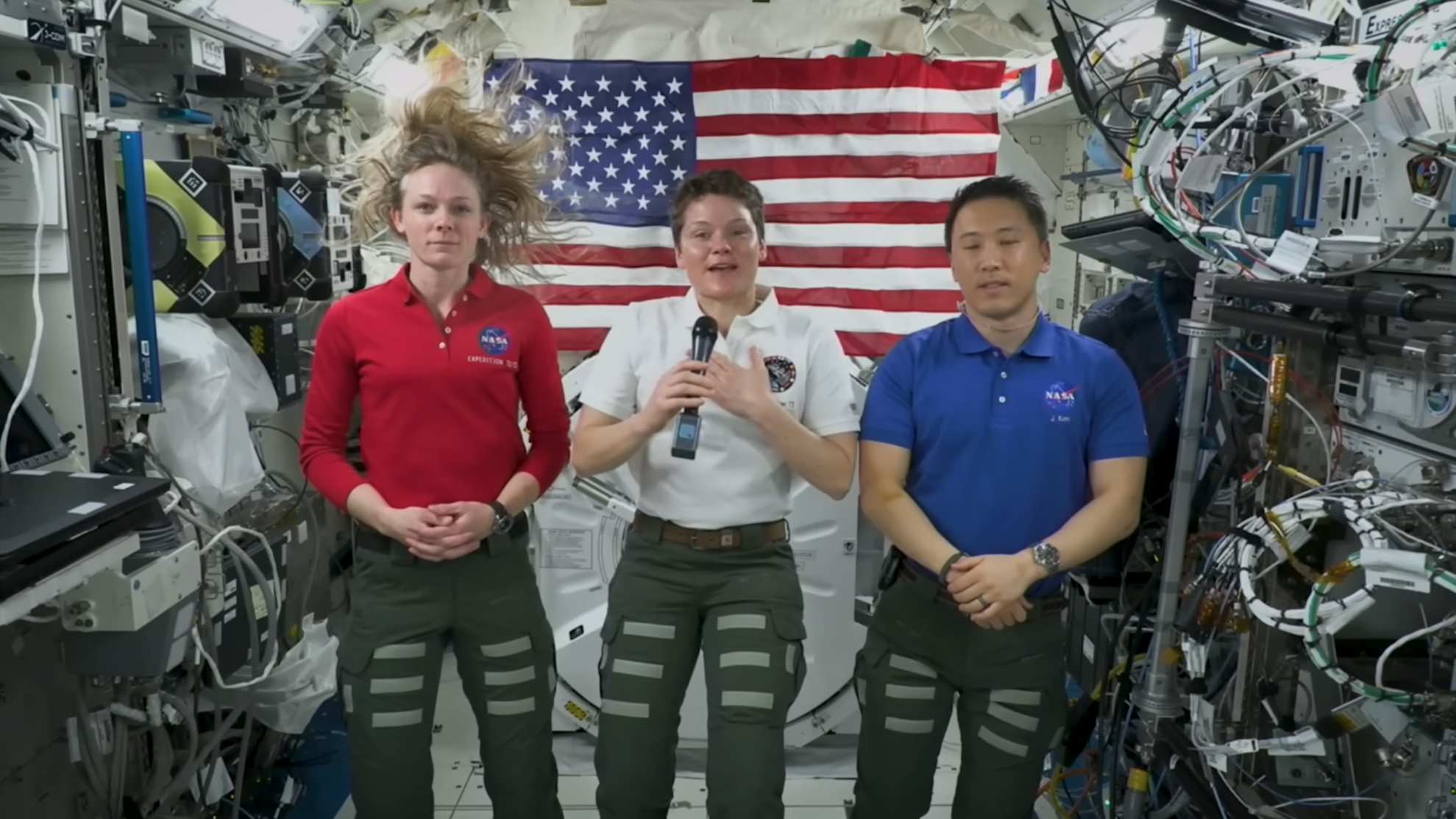 NASA astronauts (from left to right) Nichole Ayers, Anne McClain and Jonny Kim deliver a July 4 message from the International Space Station in 2025.