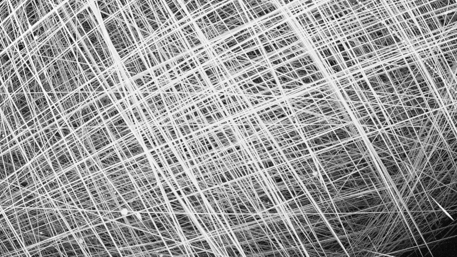 A series of white streaks across a black background